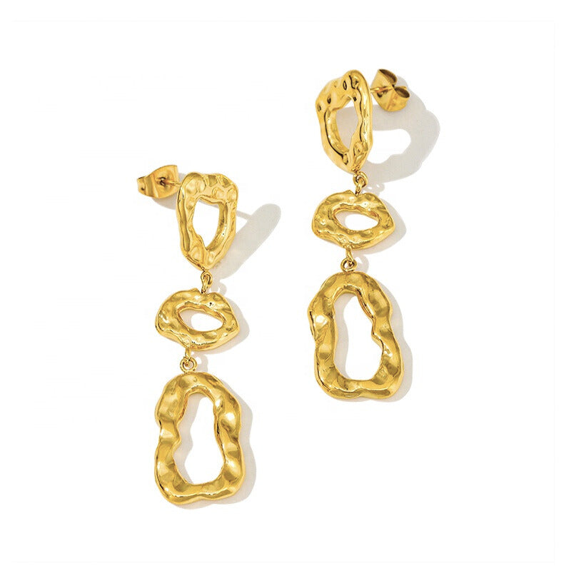 Gold hammered earrings with abstract organic shapes