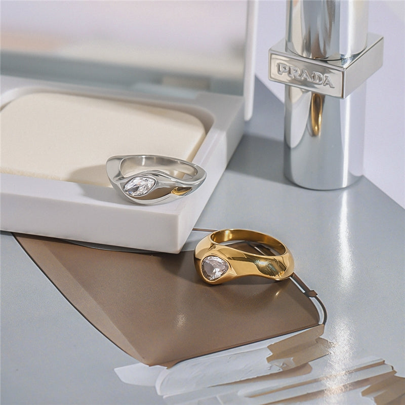 Chunky high-polish dome ring with flush set teardrop crystal available in gold and silver — waterproof hypoallergenic minimalist ring