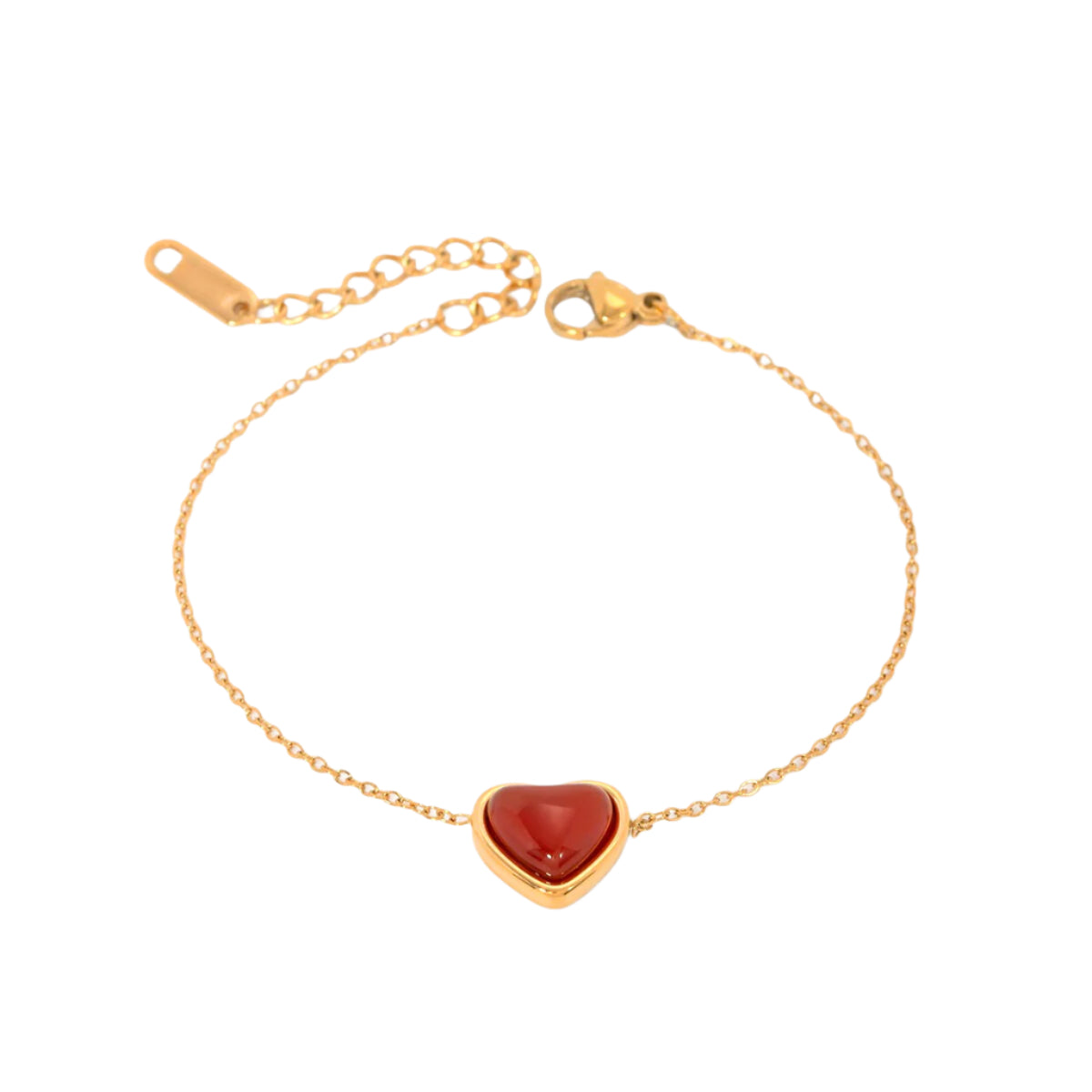Delicate gold bracelet with a small red heart charm