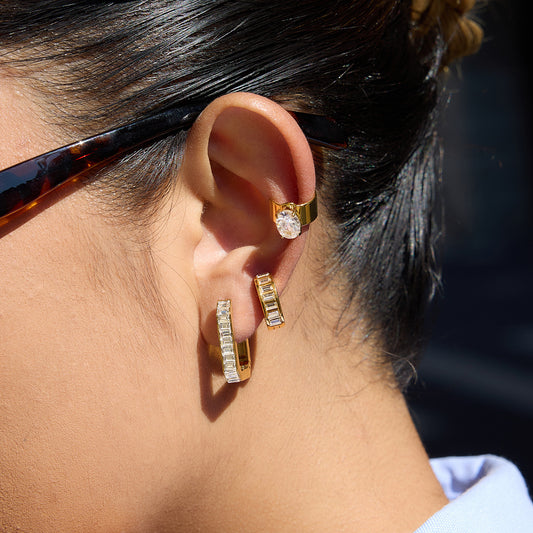 Detailed view of channel-set baguette crystals on Sofia Hoops gold-plated earring