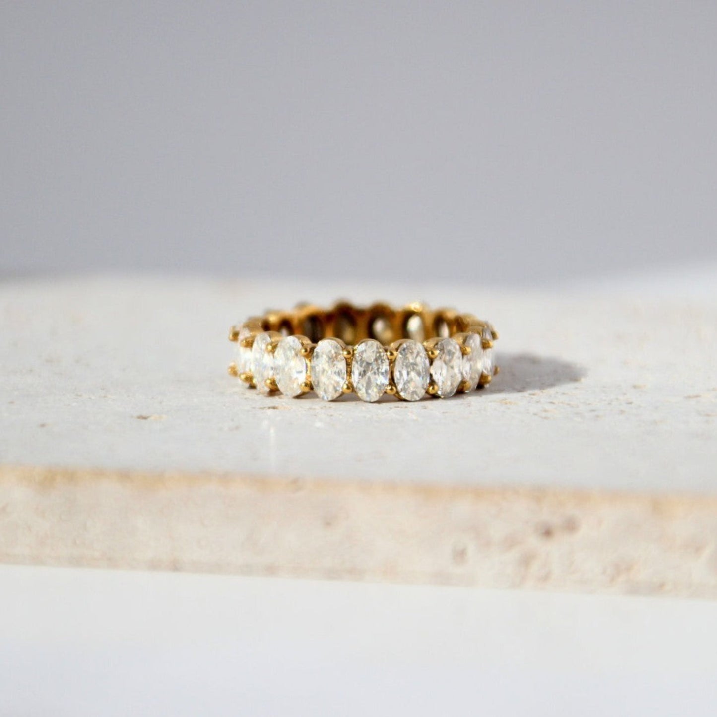 Gold-plated stainless steel eternity band with sparkling stones, waterproof and tarnish-resistant, perfect for everyday wear and special occasions