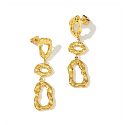 Gold hammered earrings with abstract organic shapes
