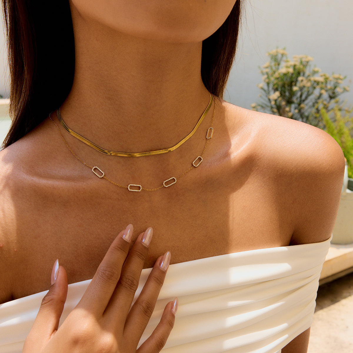 Amayah Jewelry Quince link Necklace - delicate chain with open rectangular crystal and plain link stations on white background