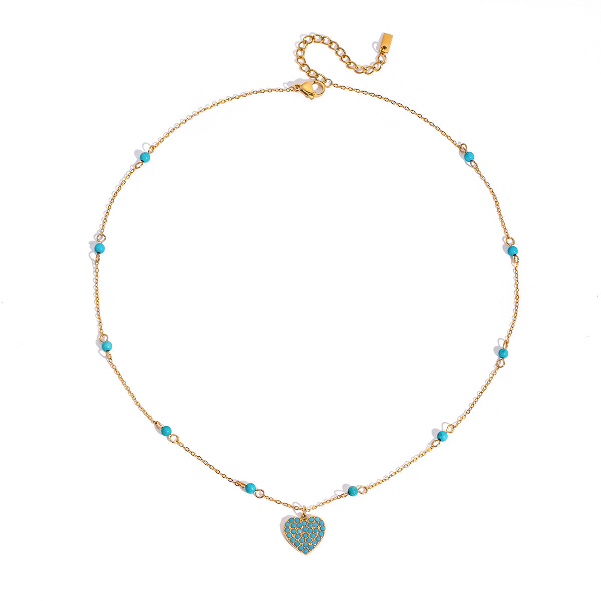 Turquoise pavé heart pendant necklace on delicate gold chain, worn layered with beaded necklaces