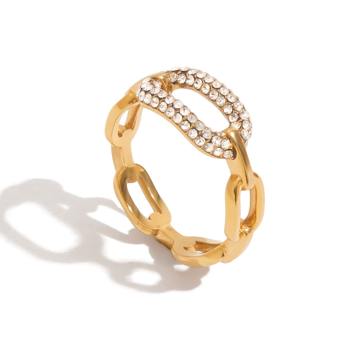 Gold ring with diamond accents on a white background