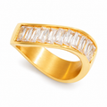 A gold ring with a curved, open-top design featuring a row of clear baguette-cut gemstones on the top surface, shown against a plain white background.