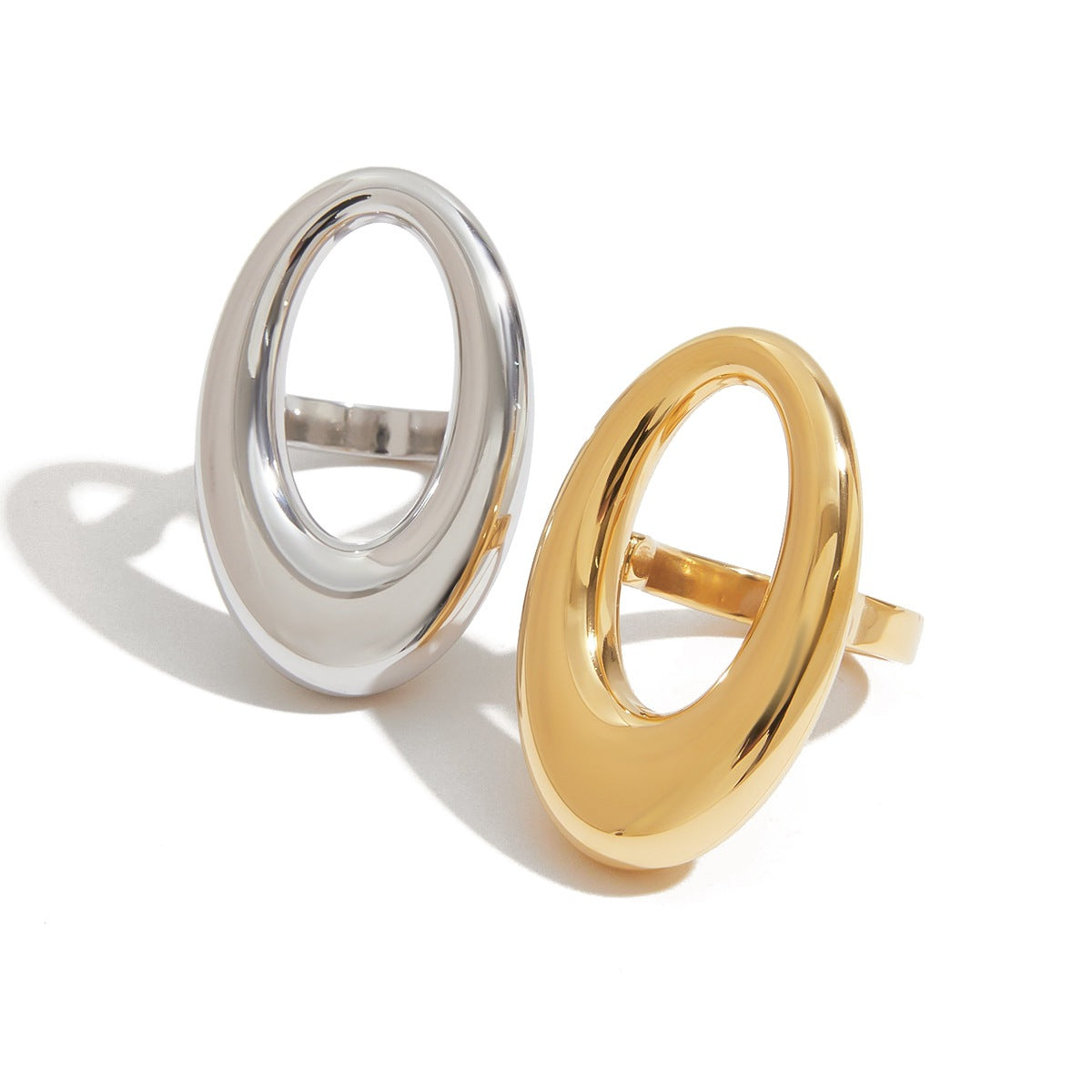 Oversized hollow oval loop statement ring on slim band in gold and silver high polish finish — waterproof hypoallergenic sculptural ring