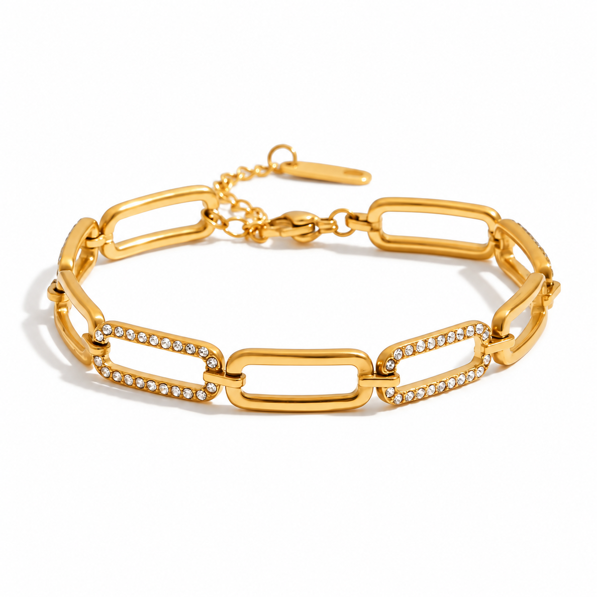 A gold link bracelet with elongated rectangular links, some accented with rows of small clear rhinestones, shown on a clean white background.