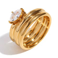 Three stackable gold band ring set with oversized prong set pear cut crystal centerstone — waterproof hypoallergenic bridal inspired statement ring
