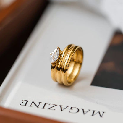 Three stackable gold band ring set with oversized prong set pear cut crystal centerstone — waterproof hypoallergenic bridal inspired statement ring
