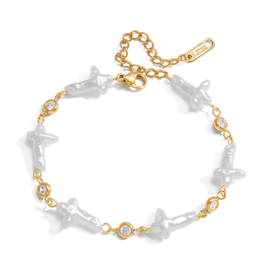 Amayah Jewelry Pearl Cross Bracelet — cross shaped baroque pearls alternating with bezel crystal stations on gold chain