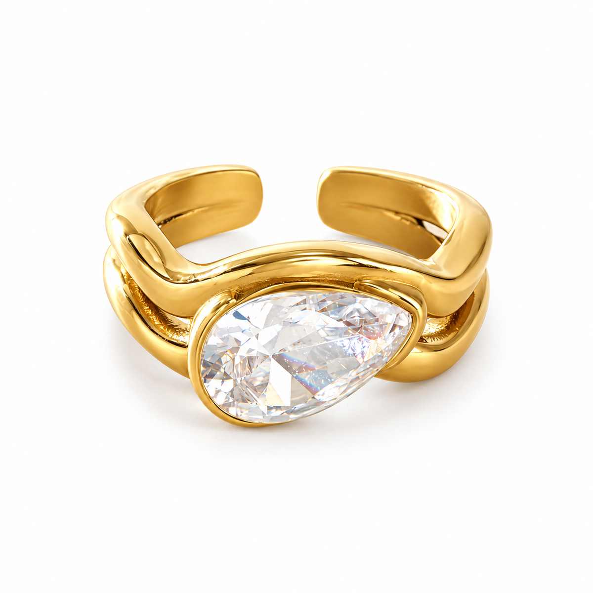 A gold-plated open shank ring featuring a large, bezel-set pear-cut clear gemstone, shown on a clean white background.