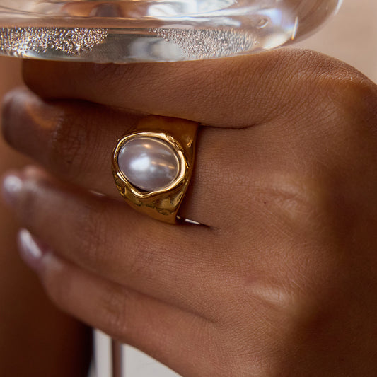 Chunky hammered gold signet ring with large oval freshwater pearl center stone — waterproof hypoallergenic luxury pearl ring