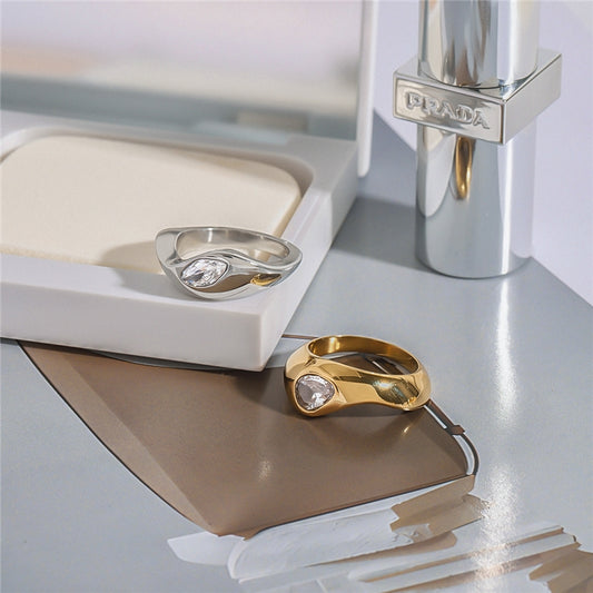 Chunky high-polish dome ring with flush set teardrop crystal available in gold and silver — waterproof hypoallergenic minimalist ring