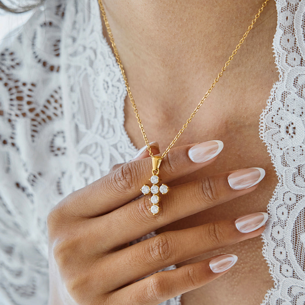 Amayah Jewelry Valentina Cross Necklace — crystal cross pendant with prong-set round stones on cable chain, white background