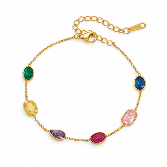 A gold chain bracelet featuring seven colorful gemstone accents in various shapes and colors including green, blue, yellow, purple, pink, and red, displayed on a clean white background.