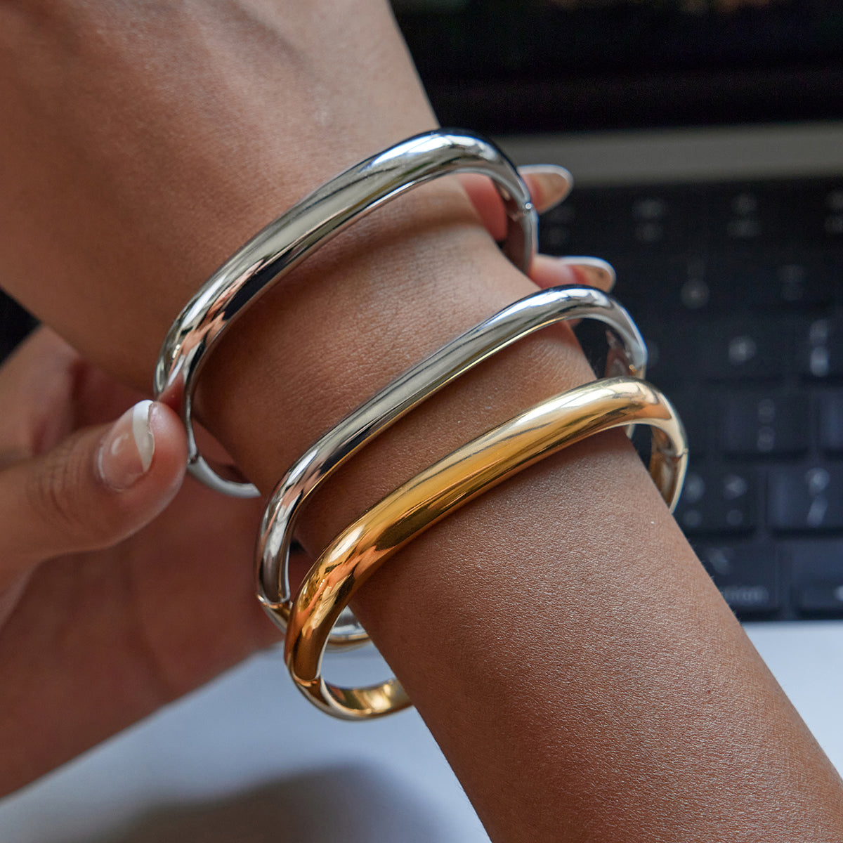 Amayah Jewelry Luna Sculpted Bangle — chunky polished square bangle.