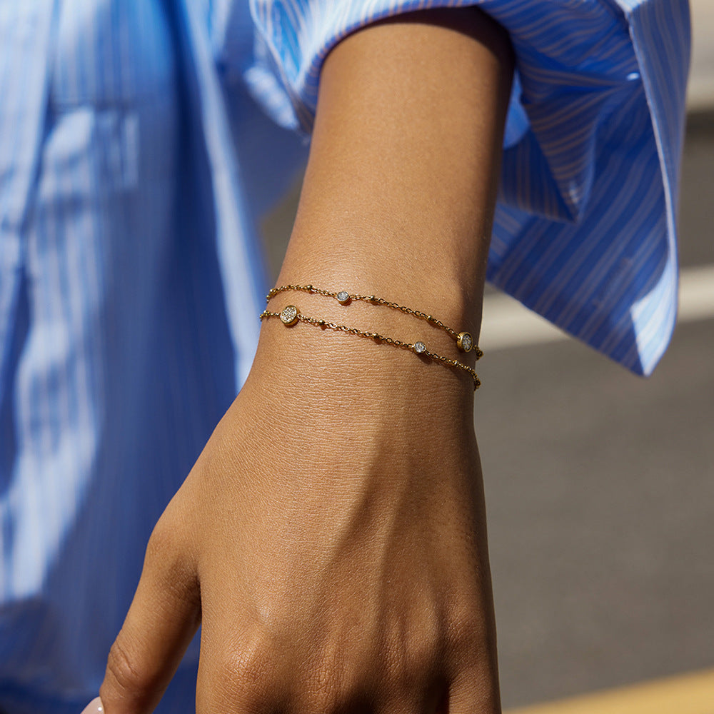 Amayah Jewelry Sofia Crystal Charm Bracelet — delicate satellite chain with bezel crystal circles