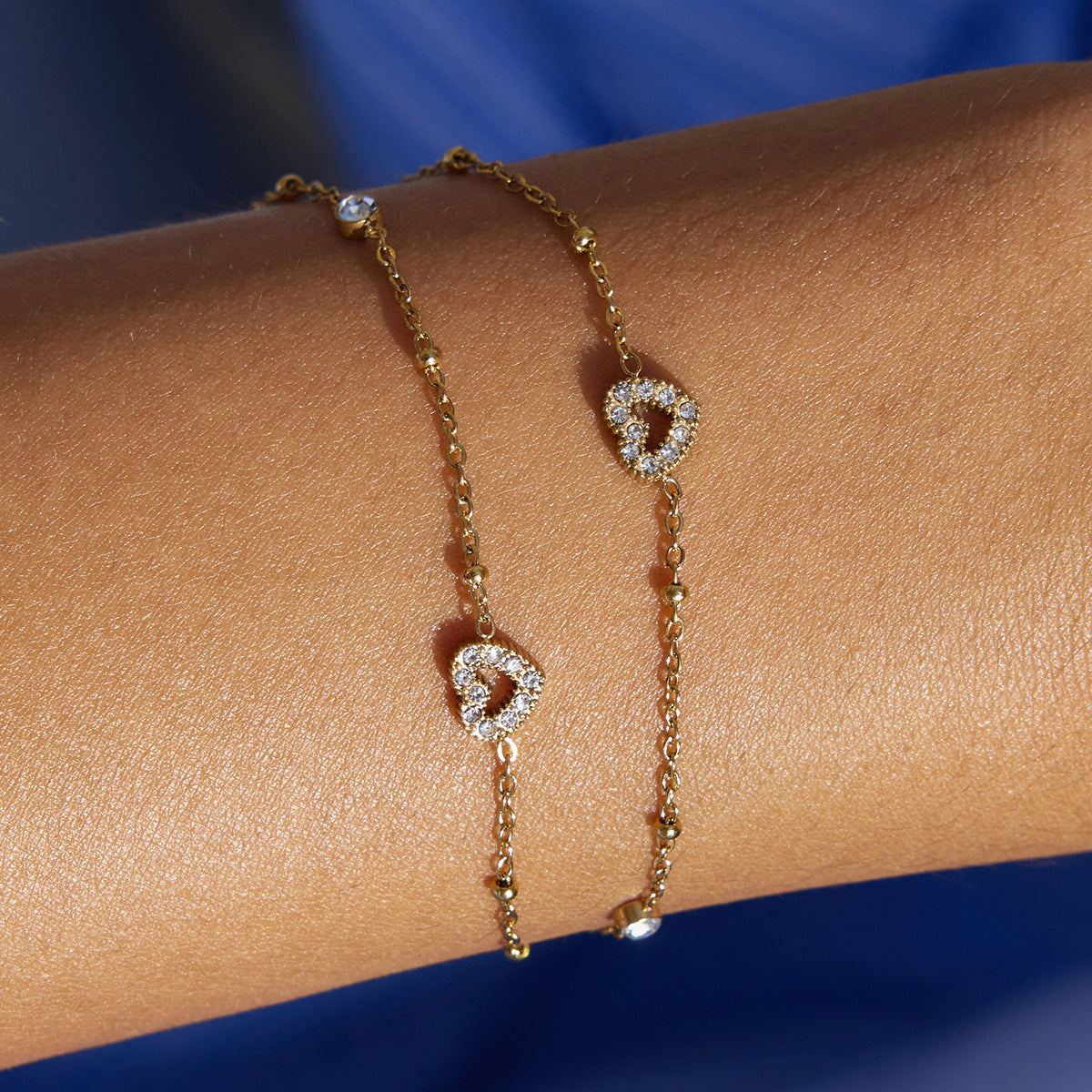 Amayah Jewelry Sofia Crystal Charm Bracelet — delicate satellite chain with heart charms