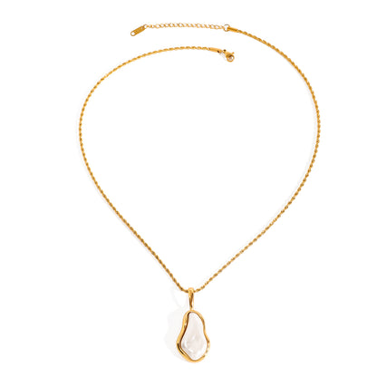 Amayah Jewelry Camille Pearl Pendant Necklace — baroque pearl in open gold frame bezel on twisted rope chain, white background