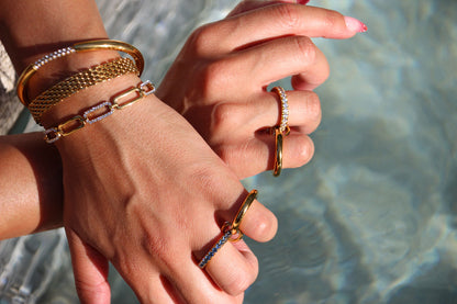 Gold-plated stainless steel statement ring with sparkling stones, waterproof and tarnish-resistant, perfect for bold and stylish looks.