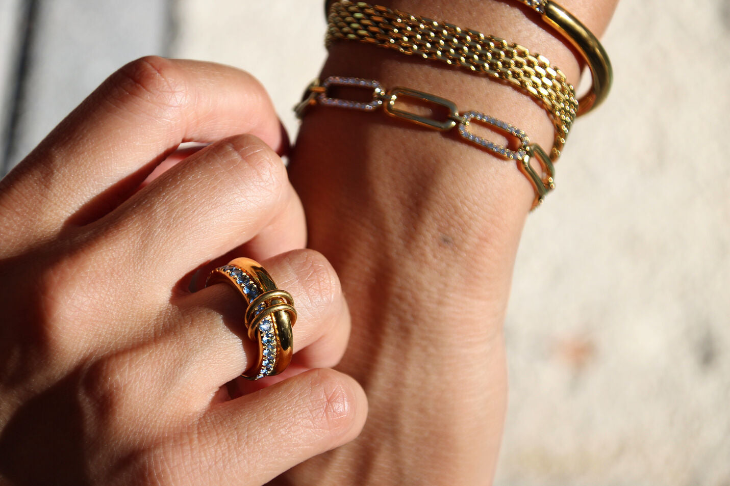 Gold-plated stainless steel statement ring with sparkling stones, waterproof and tarnish-resistant, perfect for bold and stylish looks.