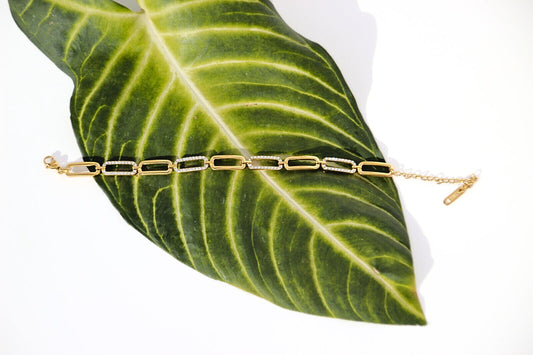 Waterproof gold link bracelet with smooth curves and sharp crystal accents