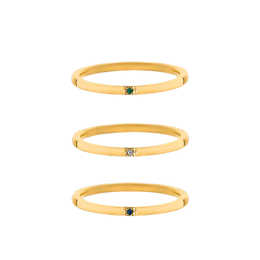 Trio of minimalist gold-plated stainless-steel rings with subtle color and sparkle, perfect for stacking or wearing solo.