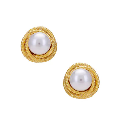 Gold swirl earrings with lustrous pearls, blending classic elegance and modern style