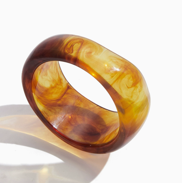 Amayah Jewelry Savanna Resin Bangle Set — three chunky resin bangles in tortoise, white marble, and brown