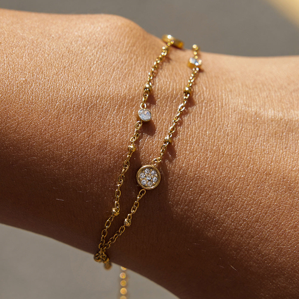 Amayah Jewelry Sofia Crystal Charm Bracelet — delicate satellite chain with bezel crystal circles.