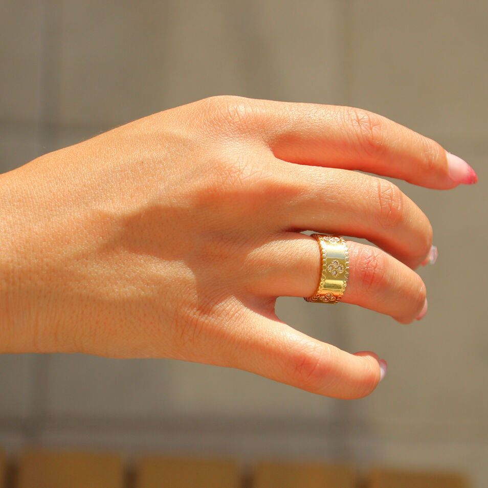 Gold clover motif ring with cubic zirconia stones, PVD gold plated stainless steel, waterproof and tarnish-free, elegant statement jewelry for everyday or special occasions
