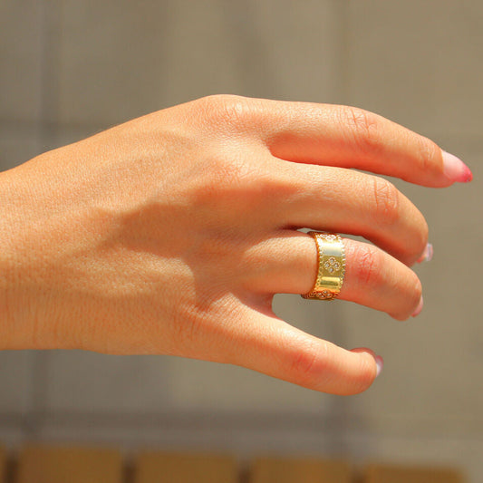 Gold clover motif ring with cubic zirconia stones, PVD gold plated stainless steel, waterproof and tarnish-free, elegant statement jewelry for everyday or special occasions