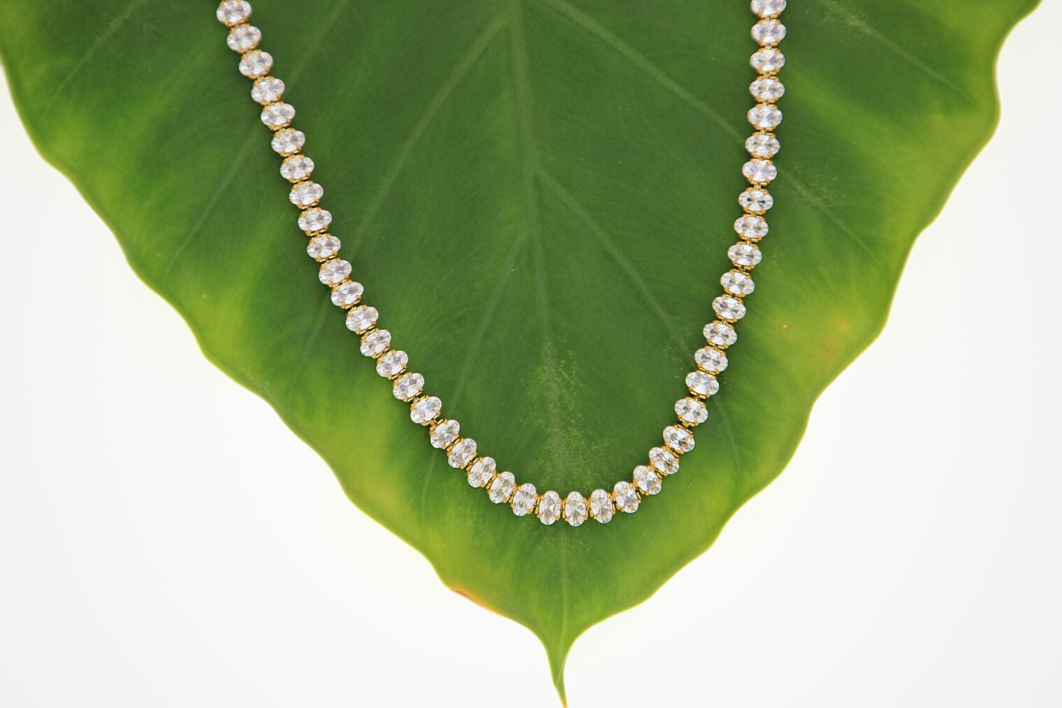 Gold tennis necklace with clear stones and secure clasp